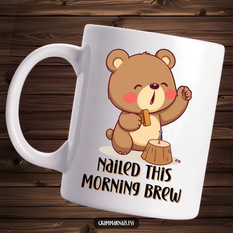 Funny mug showing a determined brown bear enthusiastically hammering a tiny nail into a wooden plank, full of focus and humor.