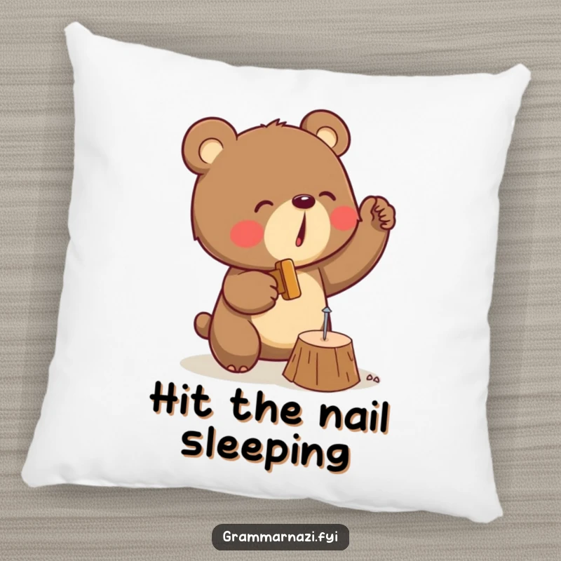 Funny pillow featuring a determined bear engrossed in enthusiastically hammering a tiny nail into a piece of wood, a comical sight.