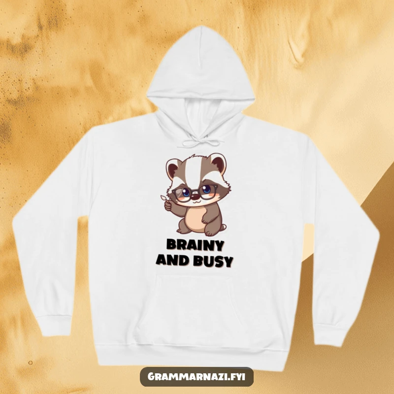 Funny Kawaii Badger Hoodie: A cute badger wearing spectacles diligently points a tiny quill, embodying focus and scholarly effort.