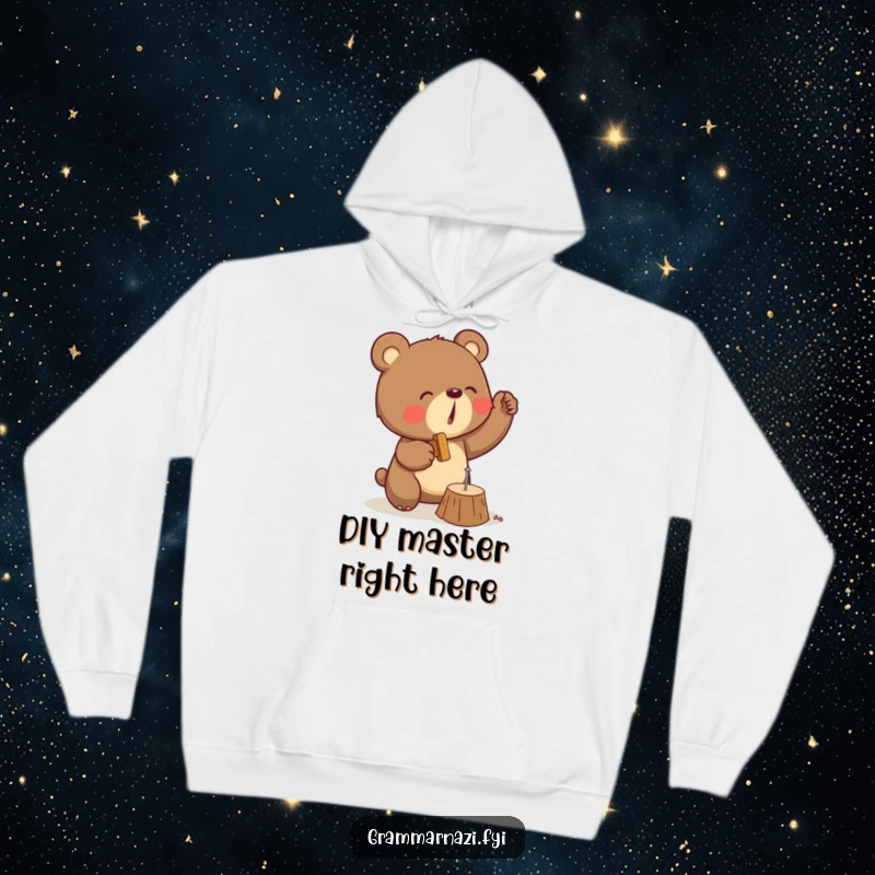 Funny hoodie depicting a determined bear with a hammer, diligently trying to hit a tiny nail into wood with great effort.
