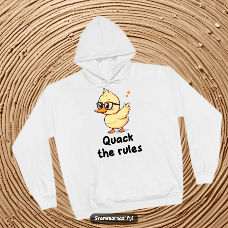Funny duckling hoodie with spectacles, excitedly pointing at an apostrophe, offering warmth and educational humor.
