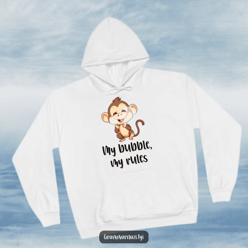 Funny hoodie depicting a mischievous monkey with a playful grin, blowing a large, translucent bubble.
