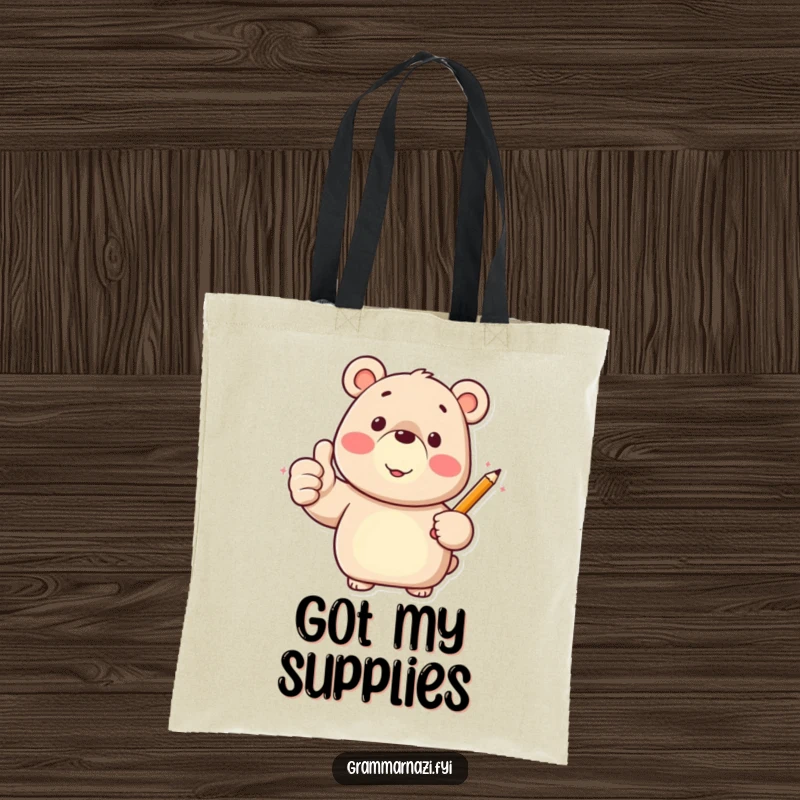Funny tote bag with a happy bear character giving a thumbs up and holding a pencil, ready for tasks.
